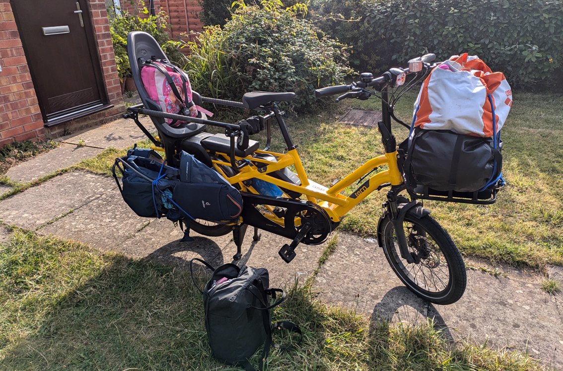 Longtail ebike loaded with bags in garden